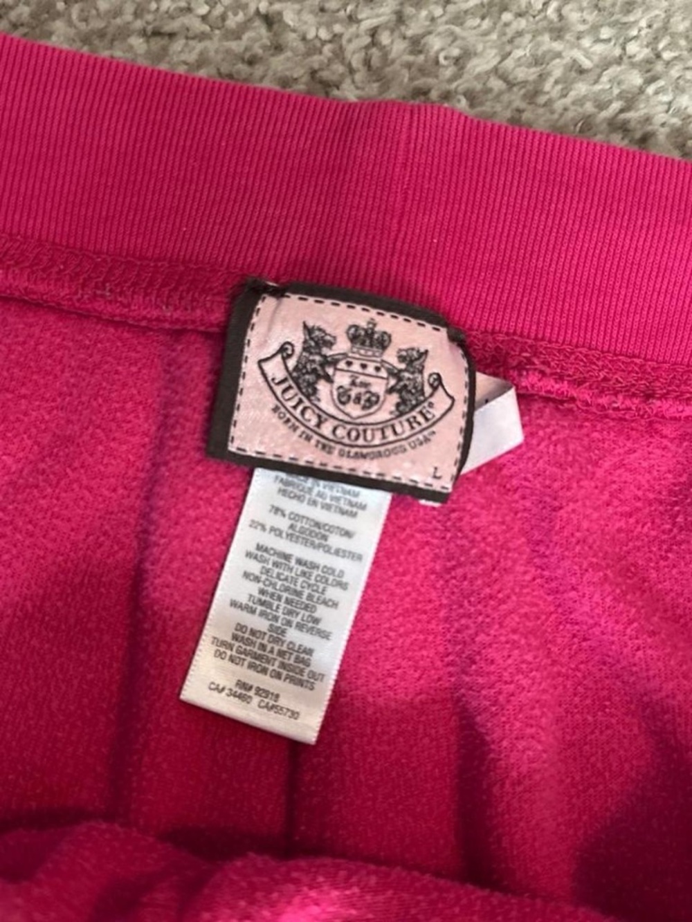 Juicy Couture pink velour sweatpants with rhinestone logo and drawstring waist.